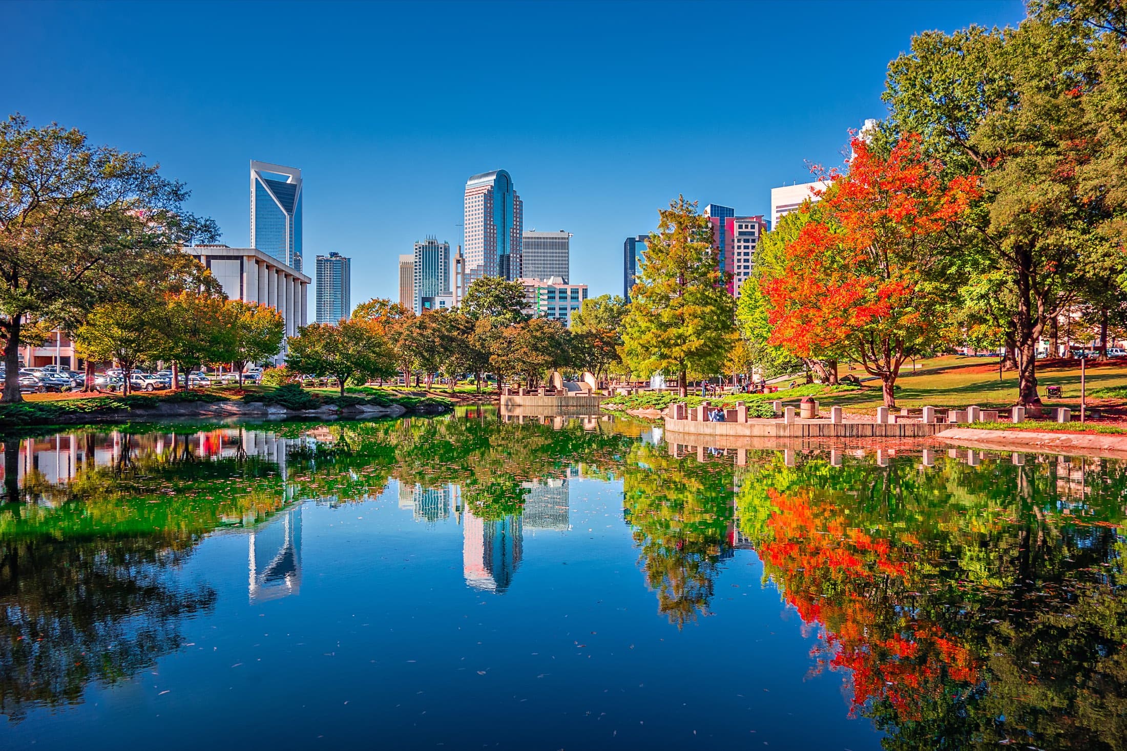 Charlotte, NC: the Uptown skyline reflected in Marshall Park on an autumn afternoon